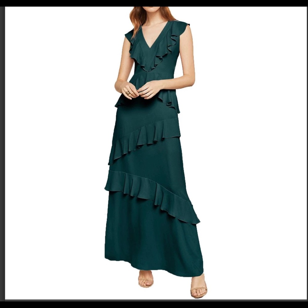 ruffled VNeck gown Deep V-Neck. Hidden back zipper